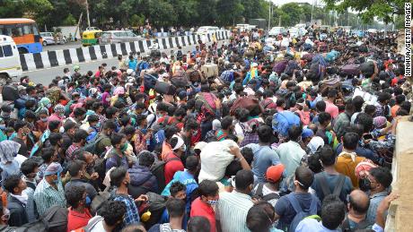 Migrant workers are waiting to board buses during the coronavirus crash in Bengaluru on May 23, 2020.  