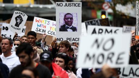Protesters marched on Queen Street in Auckland, New Zealand, on Monday. 
