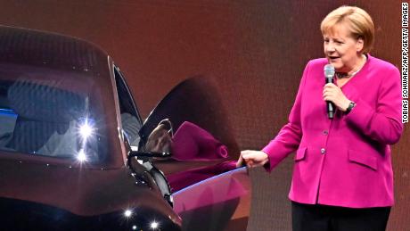 German Chancellor Angela Merkel was pictured next to an electric Mercedes in 2019.