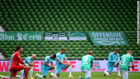 Players from both teams knelt on Sunday to protest before the Bundesliga match between SV Werder Bremen and VfL Wolfsburg in Germany.