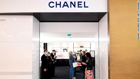 On the first day of the store, which will be reopened in Paris in May, assistants who welcomed their customers to Chanel at Galeries Lafayette.