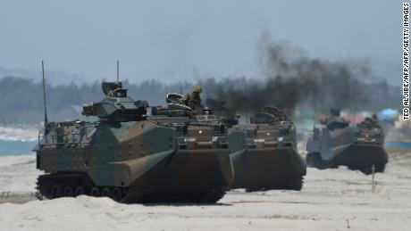 Japanese Land Defense Forces & # 39; Amphibious assault vehicles hit the beach during an amphibious landing exercise in the Philippines in 2018.