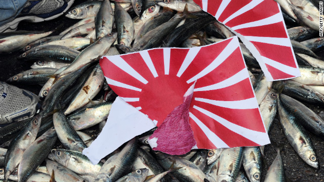 A shattered Japanese 'Rising Sun' was flagged on dead fish over the controversial Senkaku / Diaoyu island chain during a demonstration in Taipei on September 14, 2010.