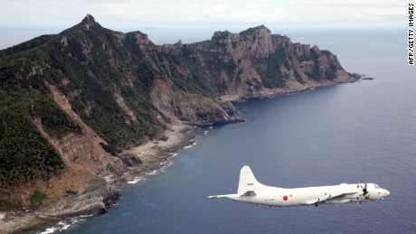 In this file photo, a Japanese military aircraft is flying over the Senakuku / Diaoyu islands.