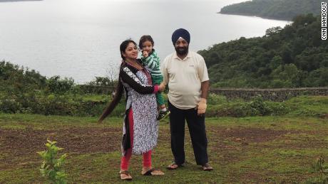 Lakhjeet Singh, 68, tested positive for Covid-19, but could not find a hospital to accept it. She is pictured with her daughter and granddaughter.