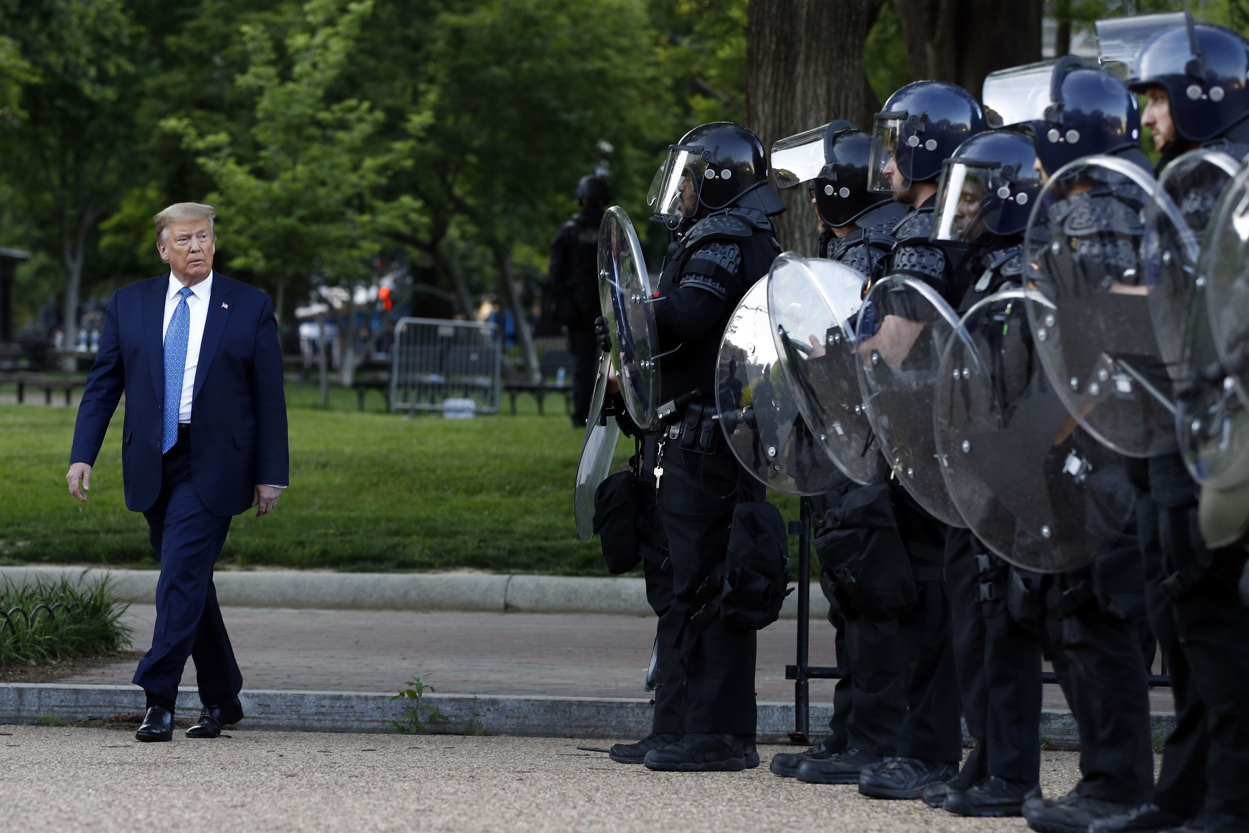 President Donald Trump passes by police officers at Washington Lafayette Park on June 1.