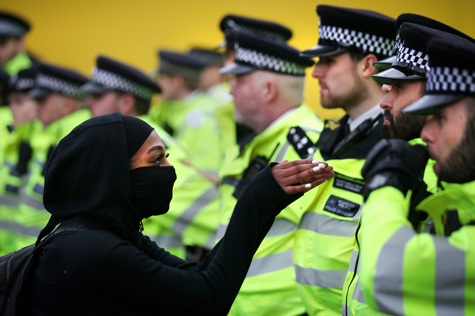 A protester faces a police officer during a Black Life Topic protest in London on June 6th.