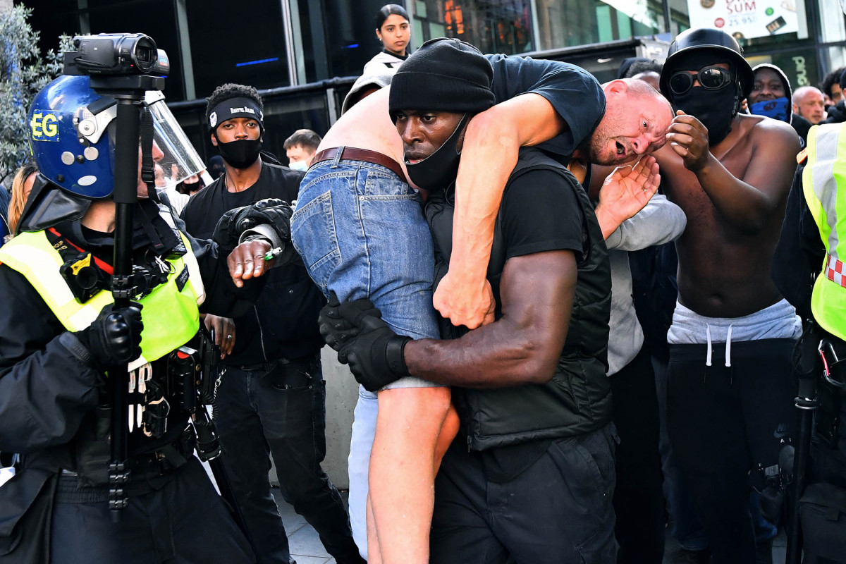 Black protester carrying white man to safety tried to avoid 'disaster'