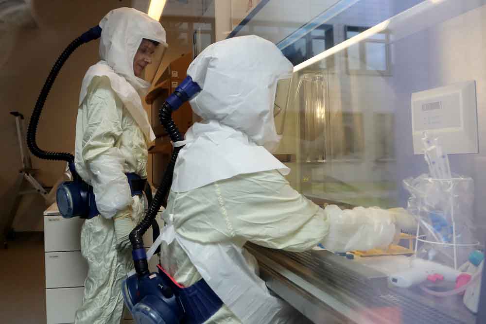 Scientists are researching in a laboratory at the Helmholtz Infection Research Center in Braunschweig, Germany, on May 25th. The Helmholtz center conducts a variety of research into the aspects of the current pandemic, including a possible vaccine. 