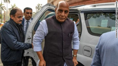 Indian Defense Minister Rajnath Singh (C) arrived in Parliament in New Delhi on February 11.