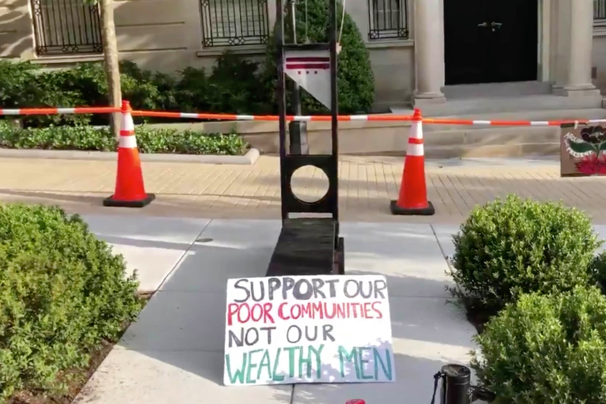 Protesters install guillotine outside Jeff Bezos' DC home
