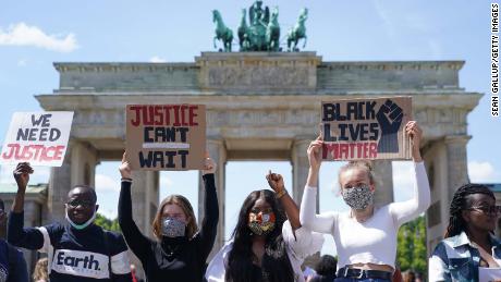 People are attending a racism rally in front of the Brandenburg Gate in Berlin on Sunday. 