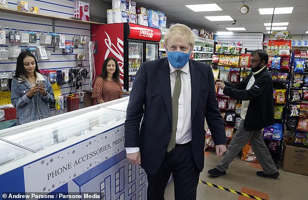 Prime Minister Boris Johnson wearing a face mask during the while campaigning in his Uxbridge constituency on Friday