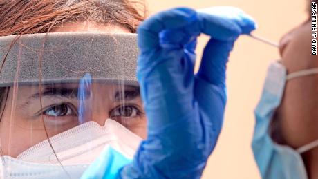 Another day record coronavirus cases, as more states rethink the mask task