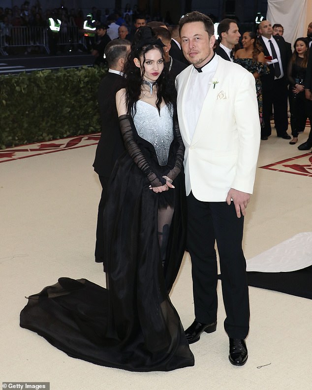 Mom duty: Elon Musk admitted that when it comes to caring for their two-month-old son X Æ A-Xii, Grimes 'has a much bigger role than [him] right now' Grimes and Elon pictured in 2018