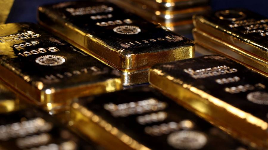 Gold stalls near record high as dollar decline pauses