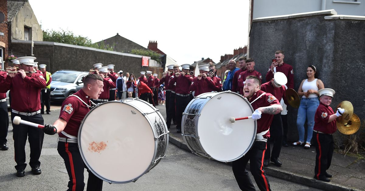 Loyalist bands march in local parades as Orange Order scale back events in Northern Ireland