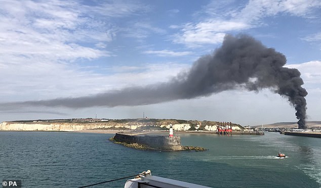 Firefighters are tackling a huge blaze tearing through an industrial building in Newhaven