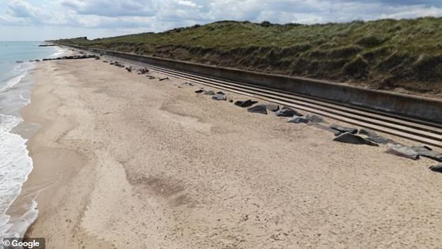The woman was pulled lifeless from the water after being caught out by the strong current at Waxham, Norfolk. She is thought to have dived in to rescue her son and his friend