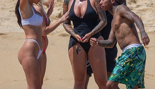 Beach Days: Amber Rose and her friends seemed to be having a good time on Thursday before the sun rose on the beach and hit the water on the jet-ski.