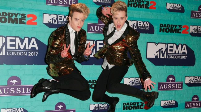 Irish duo John and Edward Grimes, AKA Jedward, pose on the red carpet arriving to attend the 2017 MTV Europe Music Awards (EMA) at Wembley Arena in London on November 12, 2017