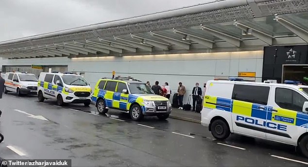 Hundreds of masked passengers (pictured) removed from Heathrow Airport's Terminal 2 have been allowed inside after discovering 'potentially suspicious objects'